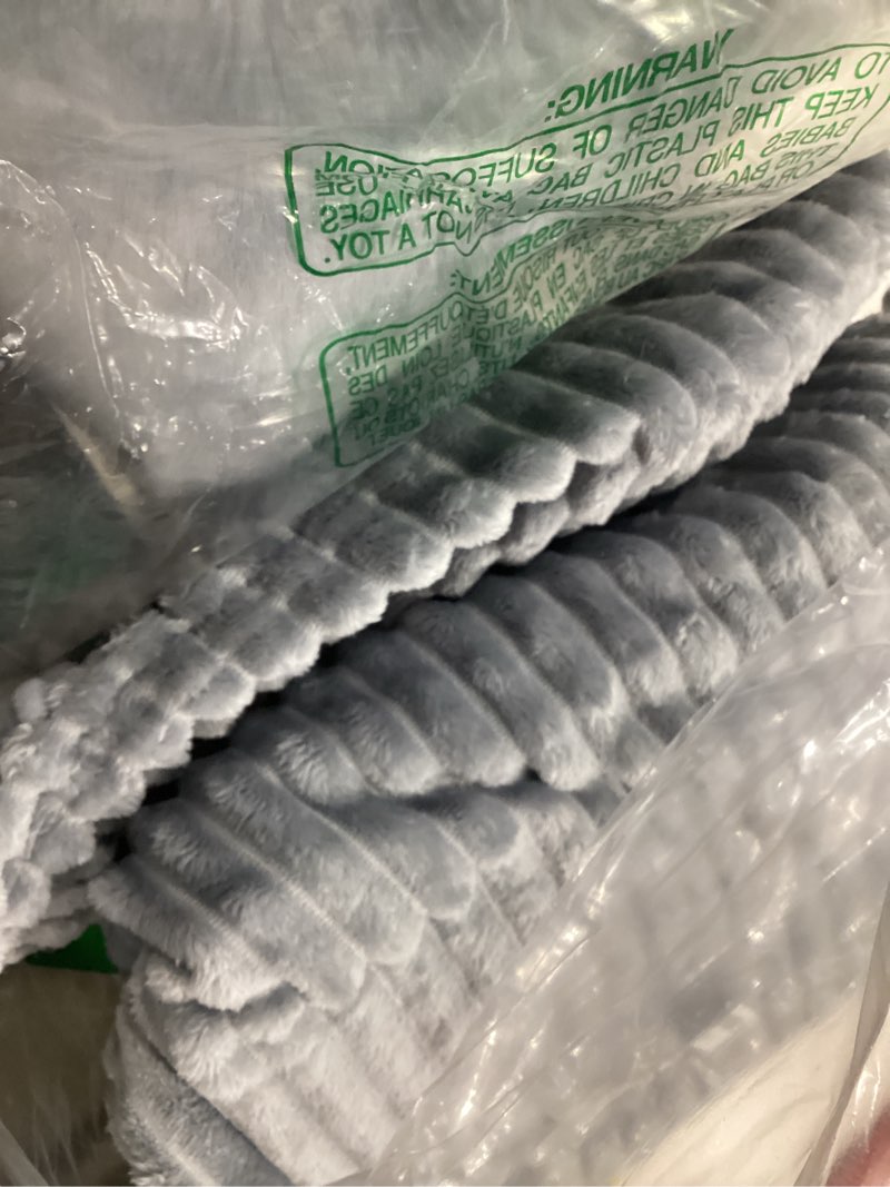 Condition photo showing Good Condition for DISSA Fleece Blanket Throw Size – 51x63, Grey – Soft, Plush, Fluffy, Fuzzy, Warm, Cozy – Perfect Throw for Couch, Bed, Sofa - with Pompom Fringe - Flannel Blanket Throw Blanket Grey 51x63"
