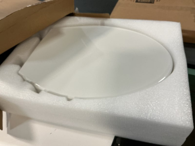 Condition photo showing As Is for swiss madison ryse 3 in. raised elongated soft close ada compliant toilet seat with bidet in glossy white