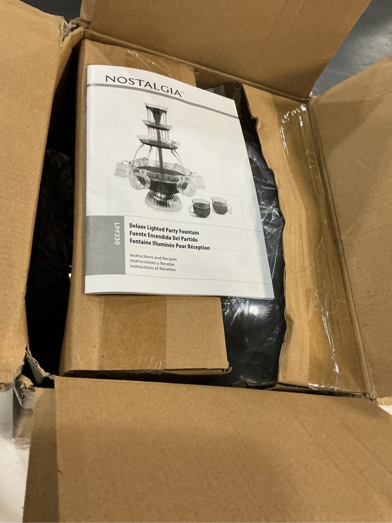 Condition photo showing Good Condition for nostalgia lpf230 3-tier lighted party fountain, holds 1.5 gallons, led lighted base, includes 8 reusable cups deluxe party fountain