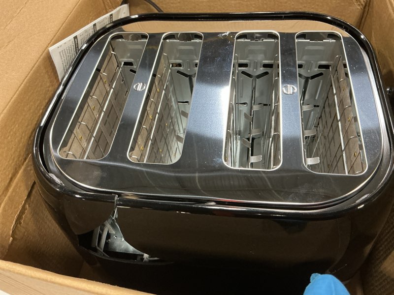 Condition photo showing As Is for black+decker 4-slice toaster, extra wide slots, 7 shade settings, 1400 watts, frozen and bagel buttons, toast shade selector, extra lift 4-slice black