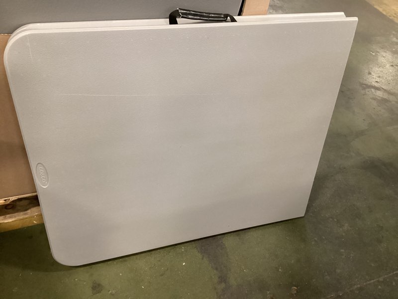 Condition photo showing As Is for 2.5-ft x 6-ft Fold-in-Half Indoor or outdoor Rectangle Resin Gray Folding banquet table 8 -Person 