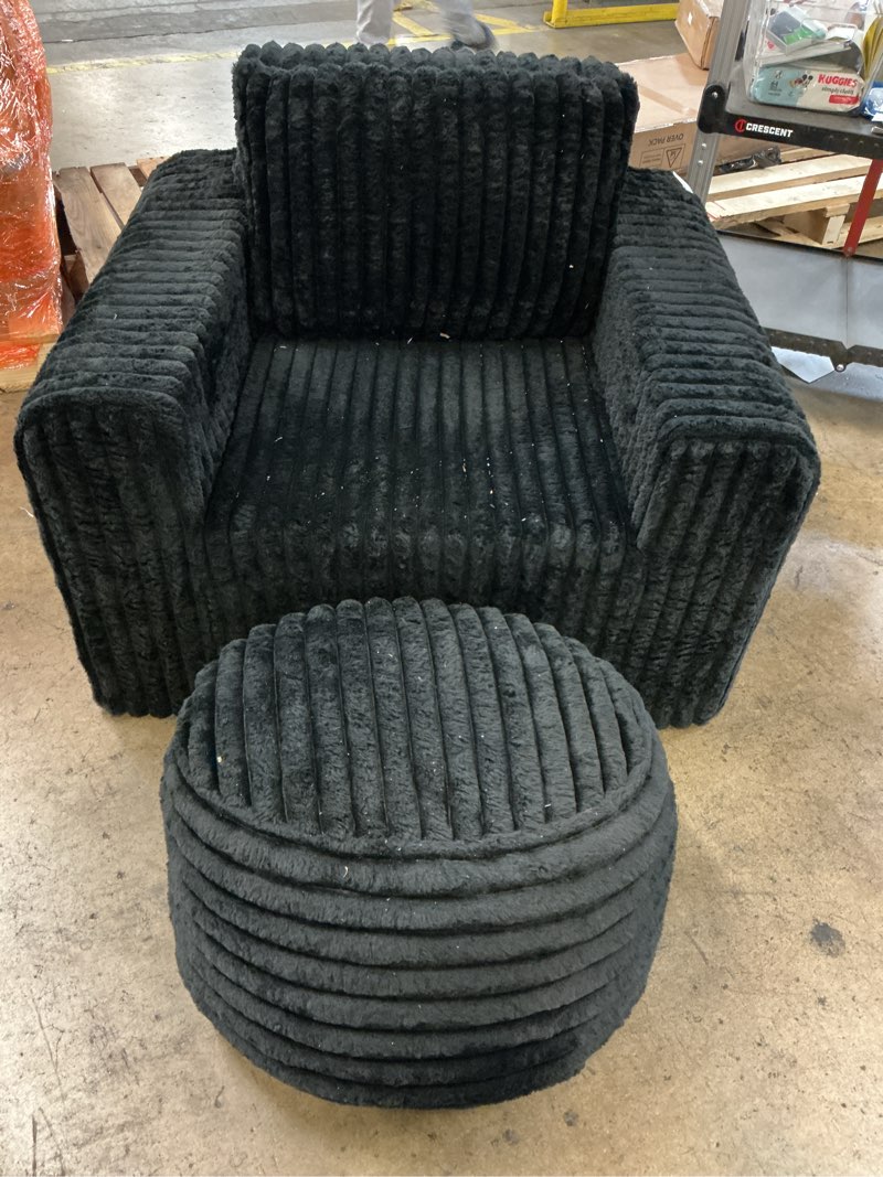 Condition photo showing As Is for black coudury chair with ottoman