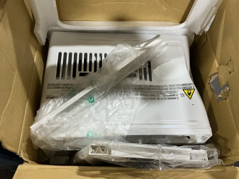 Condition photo showing As Is for 6,000 btu 115-volt window air conditioner for 250 sq. ft. rooms with remote in white