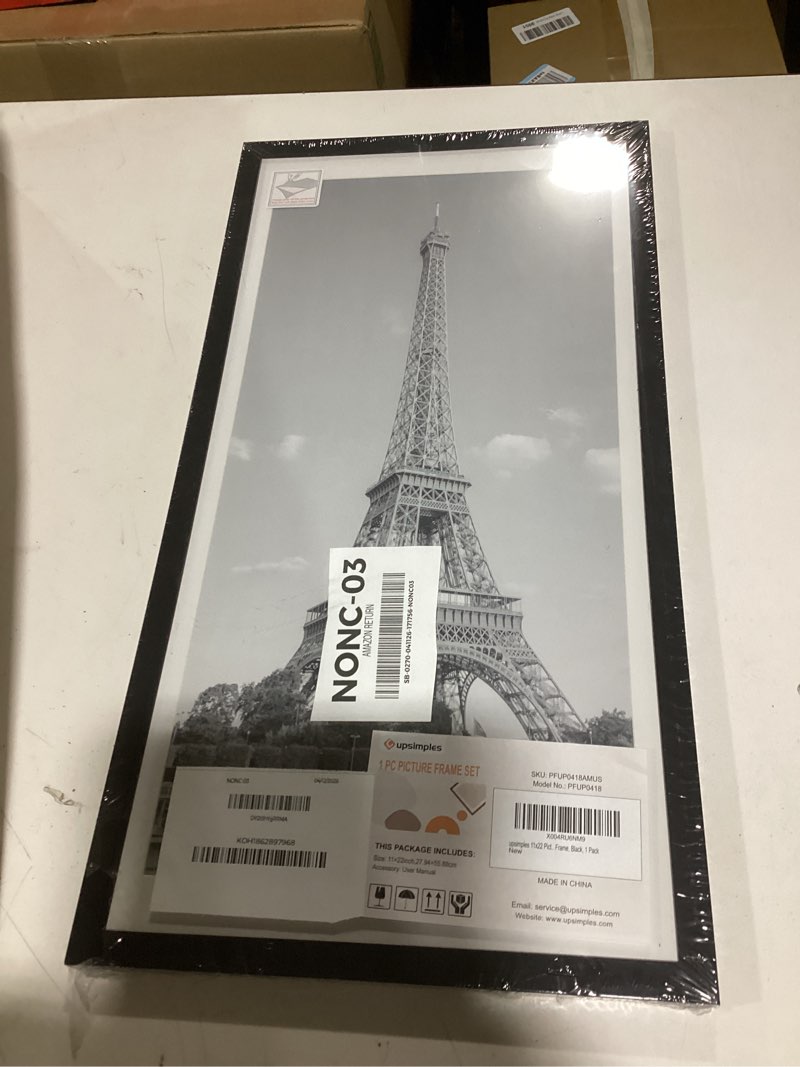 Condition photo showing New/Like New for upsimples 11x22 newspaper frame, display pictures 10x20 with mat or 11x22 without, wall hanging photo frame, black, 1 pack black 11x22