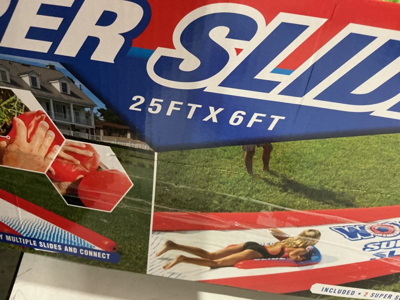 Condition photo showing As Is for wow sports super slide giant backyard slip and slide with sprinkler, extra long water slide 25 x 6 ft