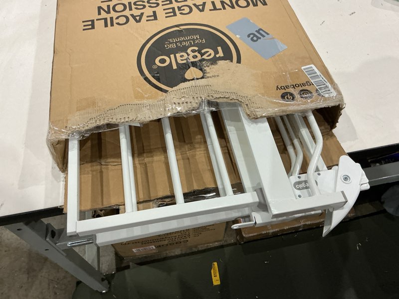 Condition photo showing Good Condition for regalo easy step 49-inch extra wide baby gate, includes 4-inch and 12-inch extension kit, 4 pack of pressure mount kit and 4 pack of wall mount kit white 29-49"w x 30"h