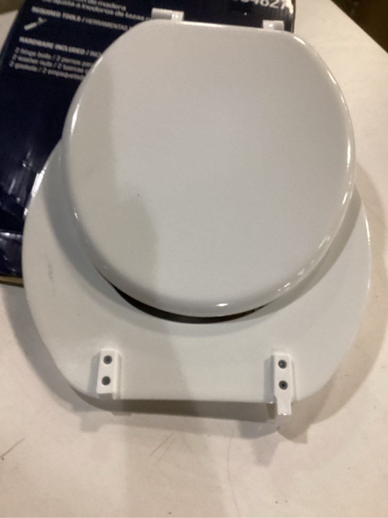 Condition photo showing As Is for Project Source 854827 Round Toilet Seat White Wood