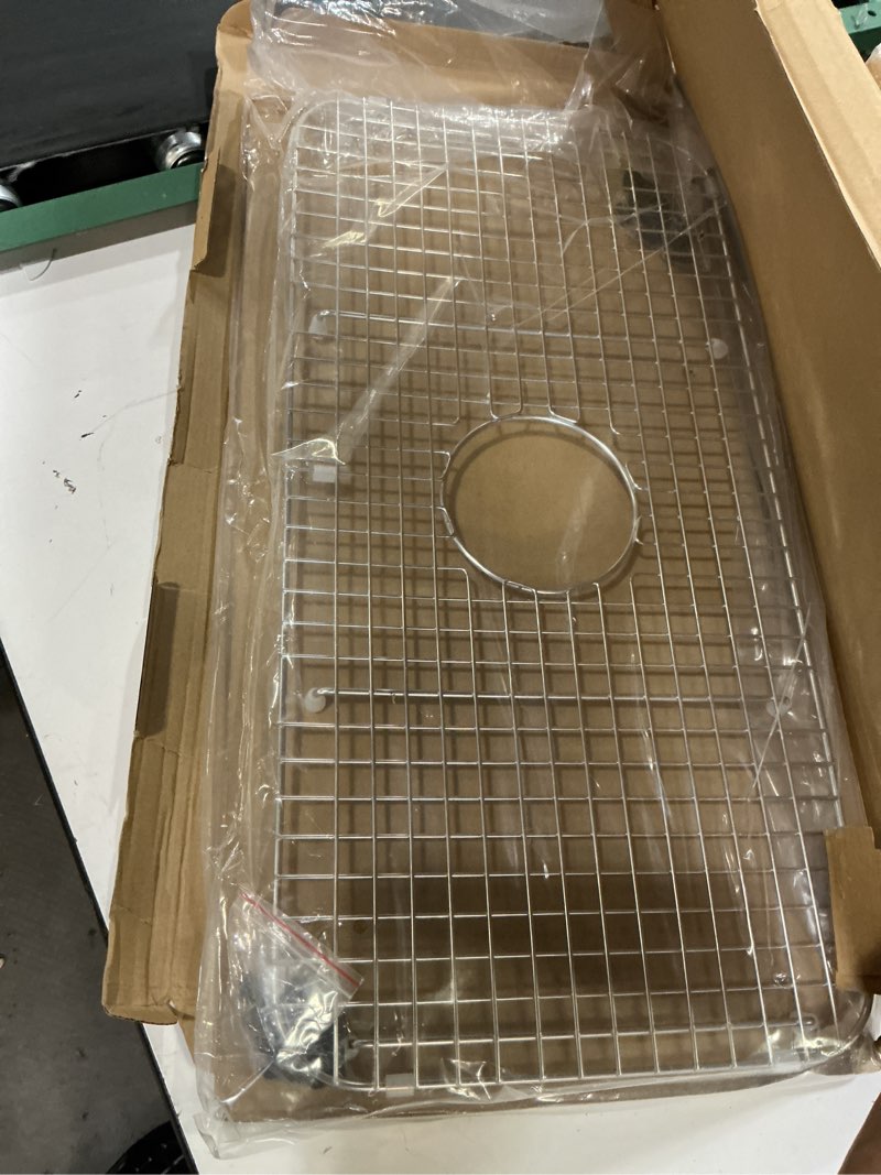 Condition photo showing New/Like New for 27.2 in. x 13.5 in. rear drain kitchen sink bottom grid with supersoft silicone feet in 304 grade stainless steel