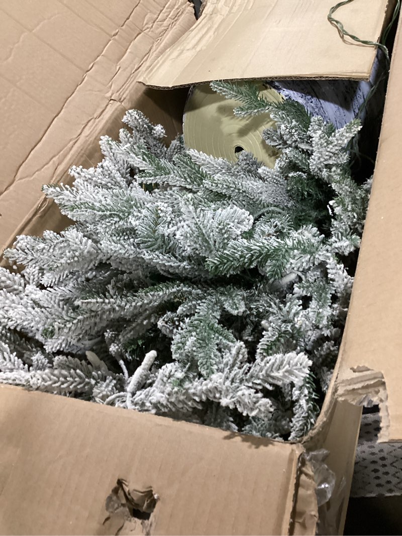 Condition photo showing Good Condition for Puleo International 4.5ft Pre-Lit Potted Flocked Arctic Fir Christmas Tree with 70 Clear Lights, 419 Realistic Dense Snow Flocked Branch Tips, Easy Setup Artificial Trees with Sturdy Stand 4.5' Flocked Arctic Fir with 70 Clear Lights