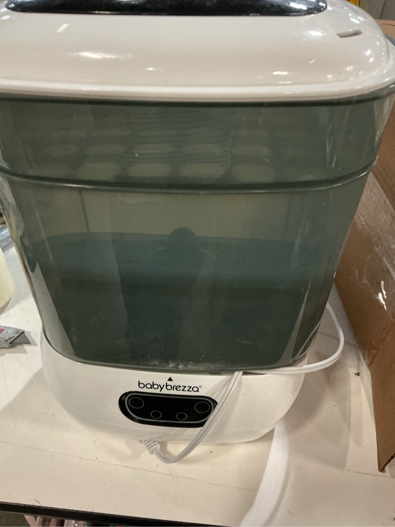 Condition photo showing As Is for baby brezza bottle sterilizer and dryer advanced – 33% faster - largest capacity steam sanitizer - universal sterilization machine for all bottles + pump parts - hepa air filter