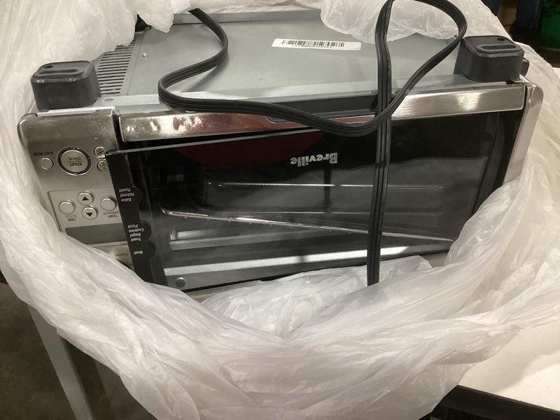 Condition photo showing As Is for Breville BOV450XL Mini Smart Countertop Oven and Toaster Oven, Small, Brushed Stainless Steel