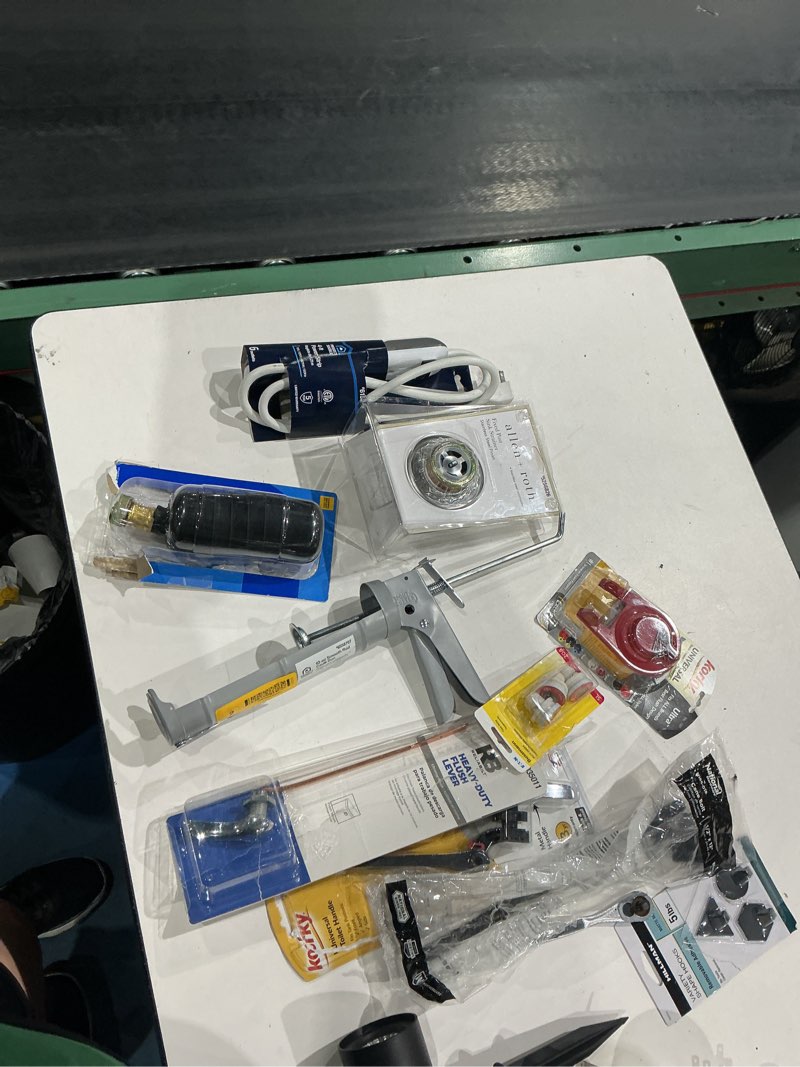 Condition photo showing As Is for assorted home improvement lot (small tools, screw, home accessories, etc.)