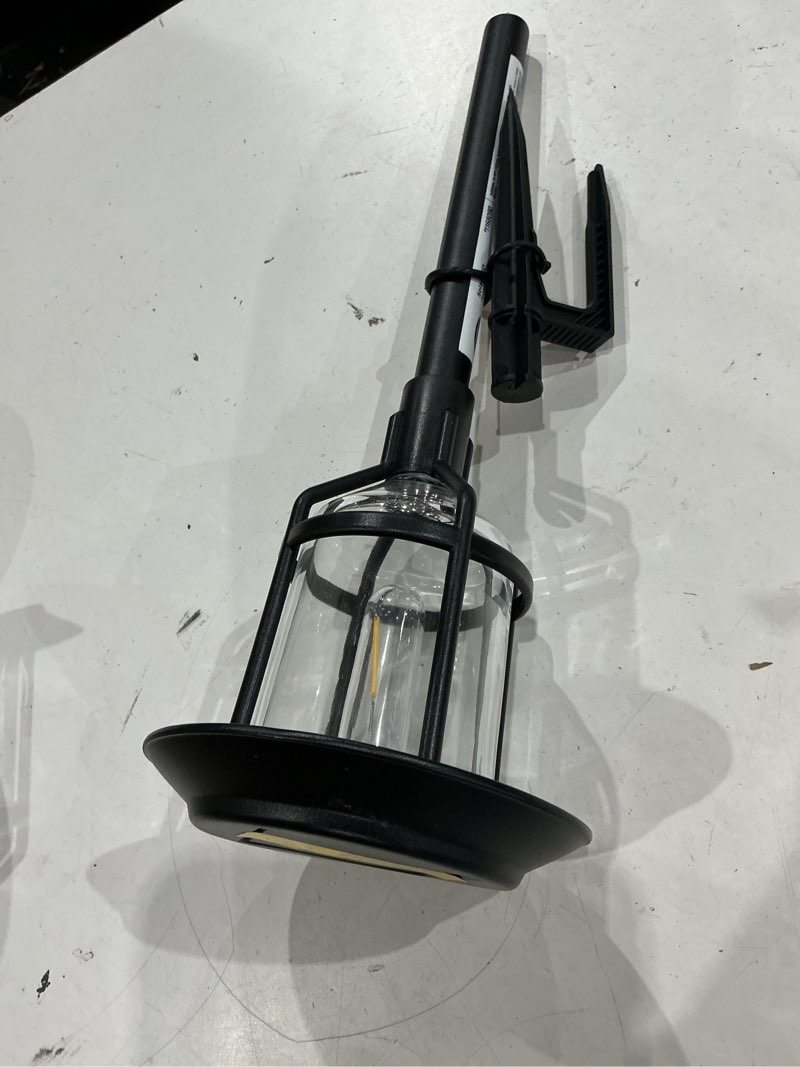 Condition photo showing As Is for harbor breeze path light 15 -lumens 0.2 -watt black solar led outdoor path light ( 3000-k )