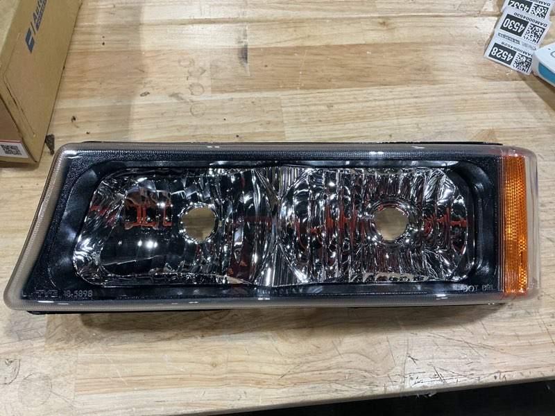 Condition photo showing As Is for (item is a different model than stock photo) automotive front left drivers side replacement headlight assembly compatible with 2003–2006 chevrolet silverado 1500 / 2500 / 3500 (including hd models) 2007 chevrolet silverado classic models 2002–2006 chevrolet avalanche