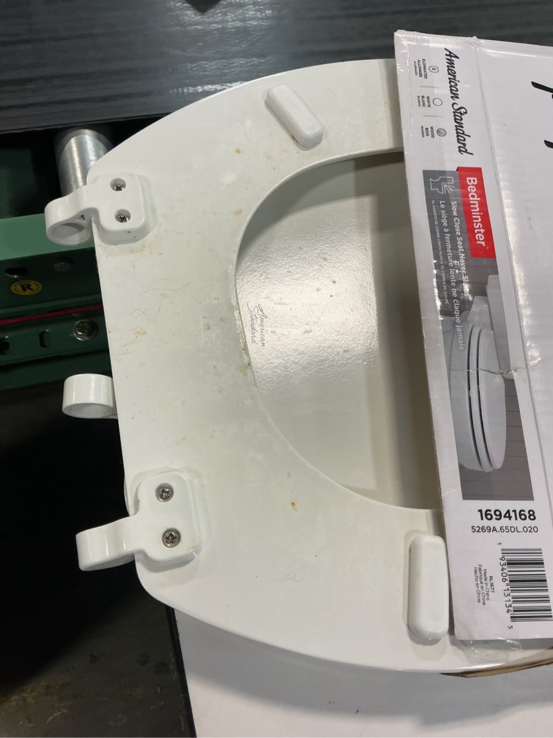 Condition photo showing As Is for american standard bedminster wood white elongated soft close toilet seat