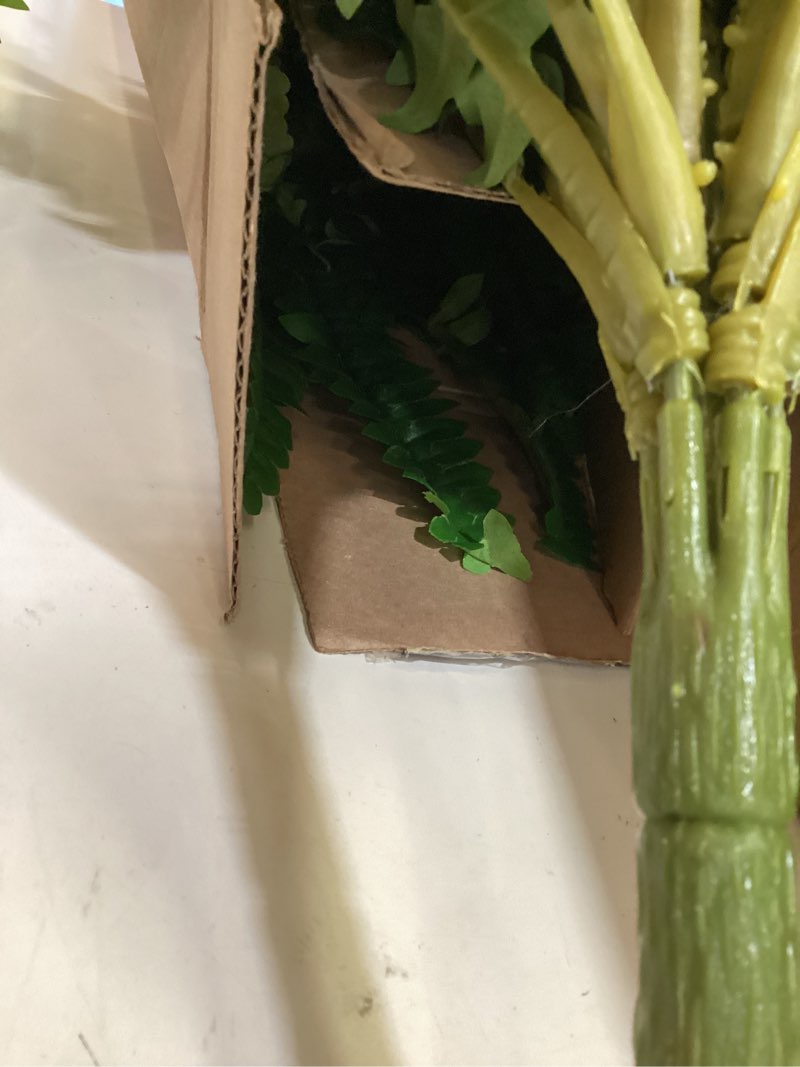 Condition photo showing As Is for artifical plant