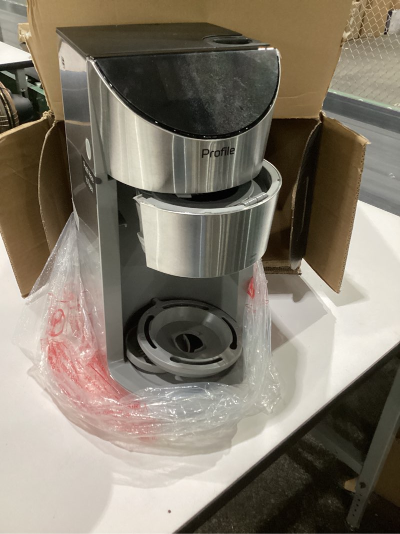 Condition photo showing As Is for ge profile smart grind & brew coffee maker w/podless single serve, 90oz water reservoir, 10 cup thermal carafe, voice control, adjustable burr grinder, sca certified, barista-quality, stainless steel, not tested