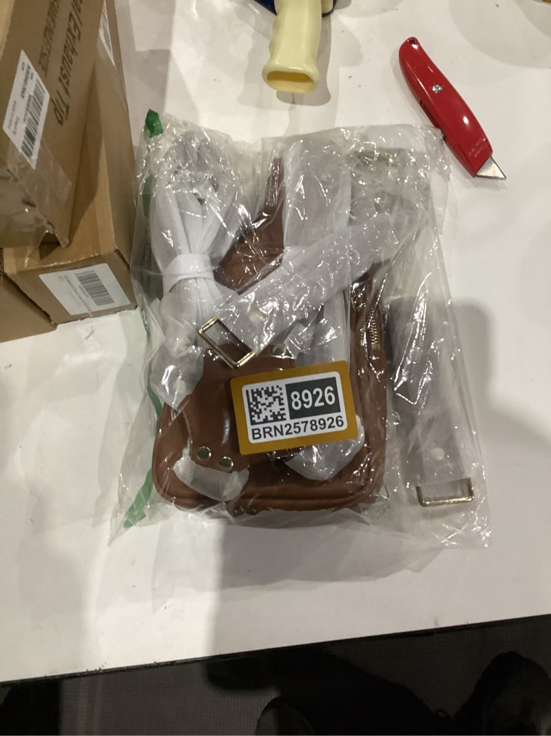 this is a ruby+rae the duo camera harness and bag in brown leather