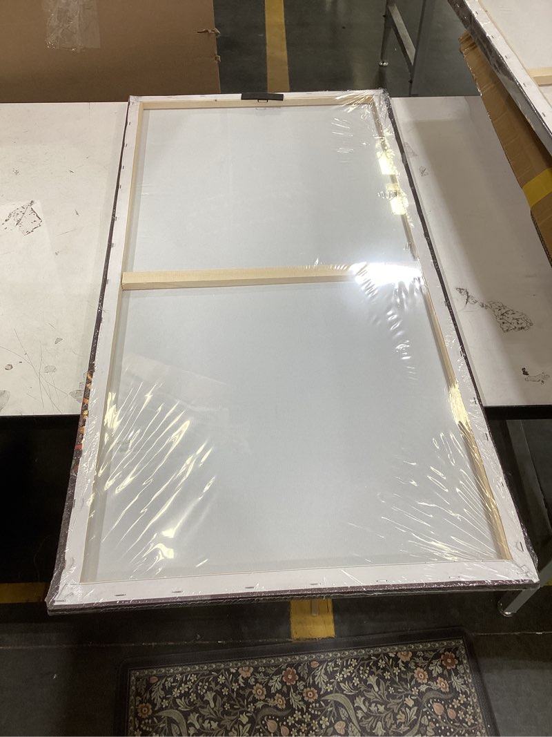 Condition photo showing New/Like New for this item is a canvas wall art print depicting an african woman adorned with gold jewelry on a black background, commonly used for home decor.  