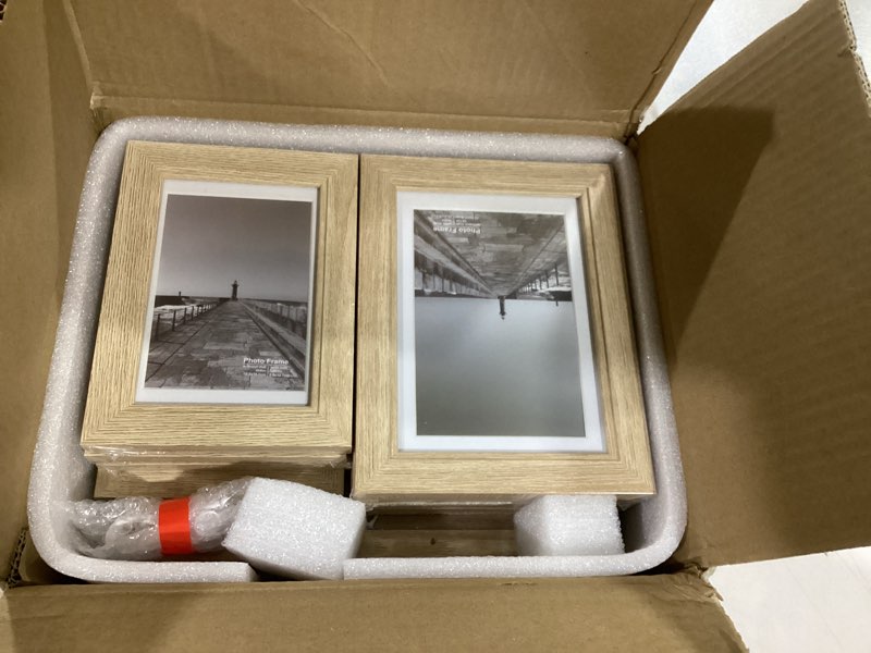 Condition photo showing New/Like New for 10 Pack Picture Frames Collage Wall Decor - Gallery Wall Frame Set with Mat for Wall Mounting or Tabletop Display, Including Two 8x10, Four 5x7, Four 4x6 Photo Frames, Real Glass Wood Grain