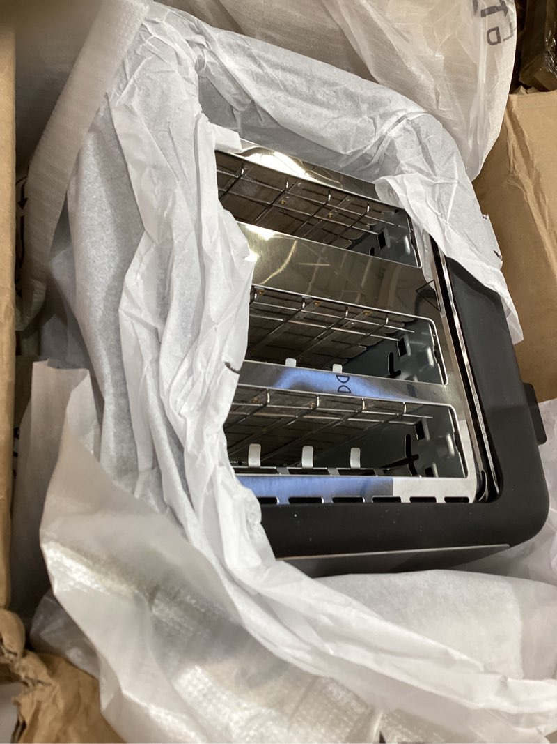 Condition photo showing Good Condition for amazon basics 4 slice toaster, 7 browning settings, extra wide slots for bagels and specialty breads, removable crumb tray, cancel/defrost/bagel buttons, 1500w, black & silver 4 slice matte black front