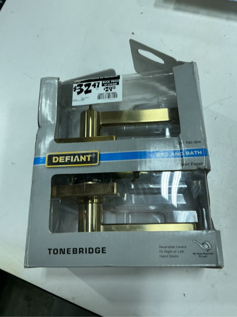 Condition photo showing As Is for tonebridge brushed gold bed/bath door lever with square rose