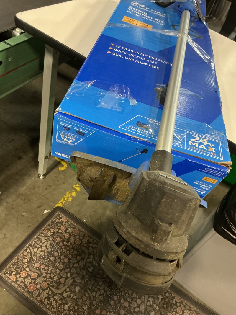Condition photo showing As Is for kobalt 24-volt 14-in straight shaft battery string trimmer 4 ah (battery and charger included)