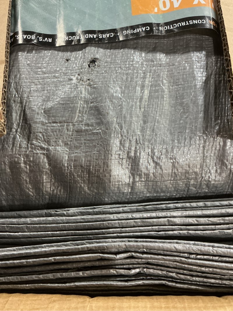 Condition photo showing As Is for heavy duty poly tarp - 40' x 40' - 10 mil thick waterproof, uv blocking protective cover - reversible silver and black - laminated coating - grommets - by xpose safety silver/black 40 feet x 40 feet