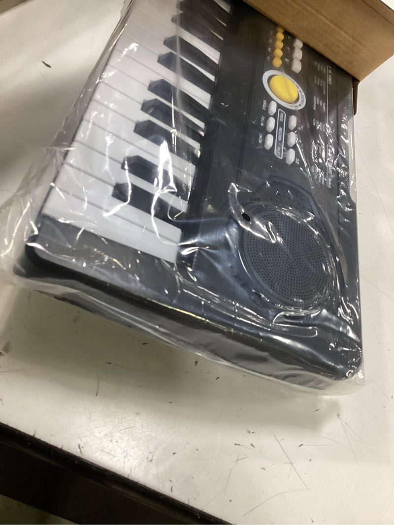 Condition photo showing Good Condition for kids piano keyboard with microphone, 49 keys portable electronic piano keyboard for kids beginners ages 3 4 5 6 7, toy music keyboard birthday xmas gift for girls boys, black