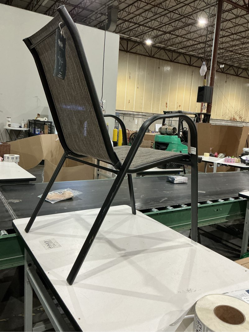 Condition photo showing As Is for style selections pelham bay stackable black metal frame stationary dining chair with tan sling seat