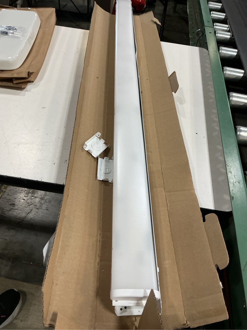 Condition photo showing As Is for mnss 48 in. 64-watt equivalent integrated led white strip light fixture 4000k
