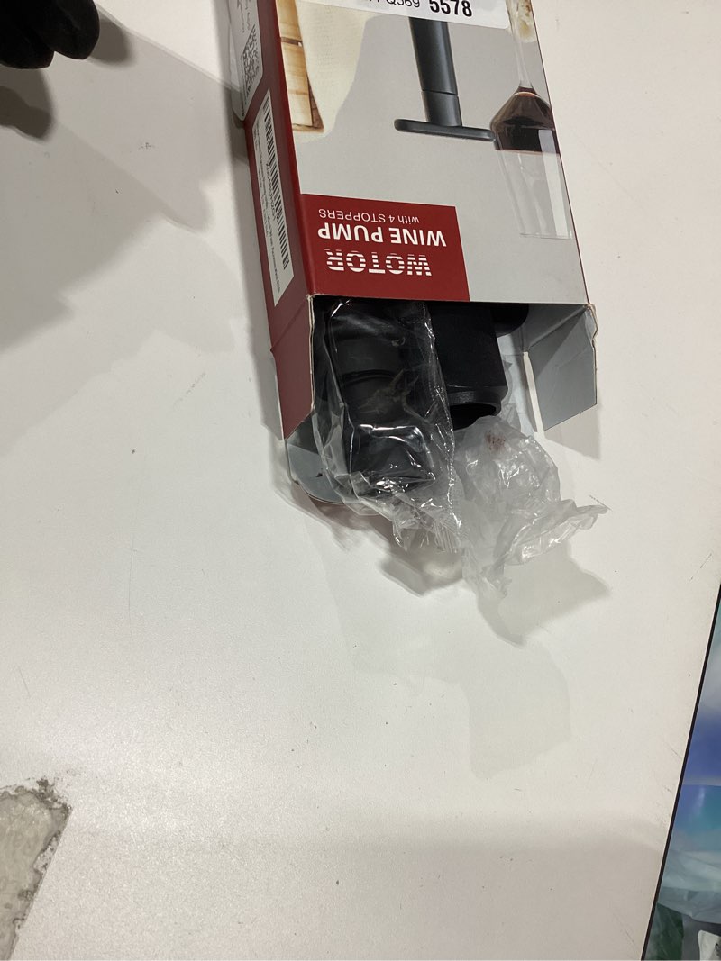 Condition photo showing As Is for WOTOR Wine Saver Vacuum Pump with 4 Stoppers, Wine Stopper & Preserver, Reusable Bottle Sealer Keeps Fresh, Ideal Accessories Gift (Flat Handle) Black 1 Pump + 4 Stoppers