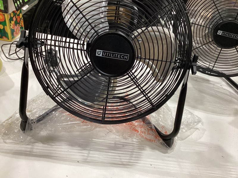 Condition photo showing As Is for utilitech 12-in high velocity indoor floor fan, battery powered, in black rechargeable