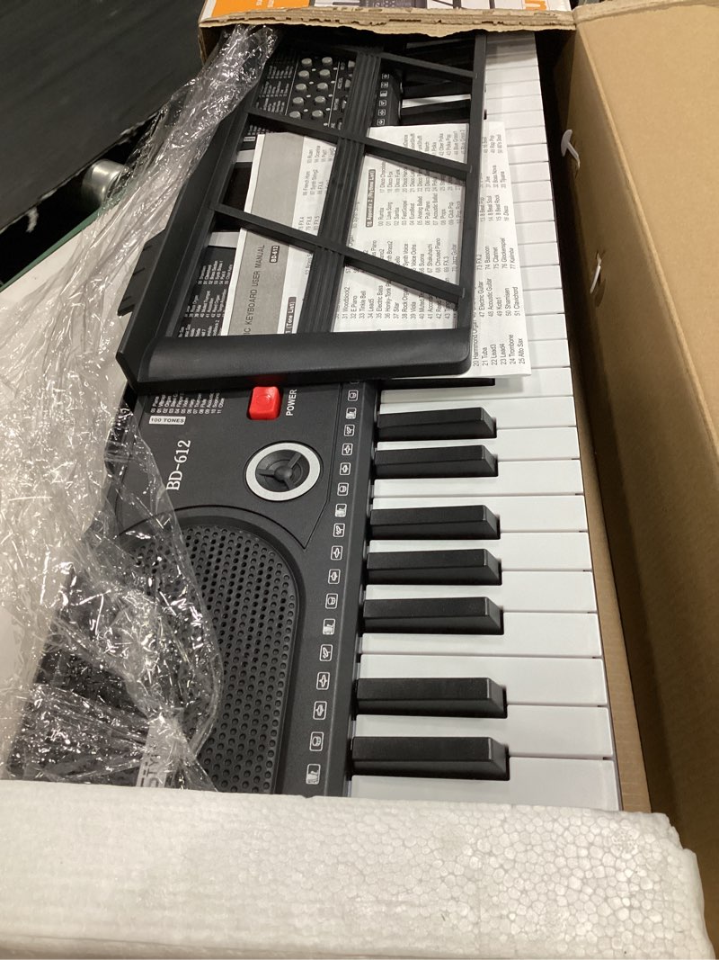 Condition photo showing Good Condition for 61 key keyboard piano, portable electronic keyboard piano for beginners with speakers, microphone, sheet music stand, 100 voices, 100 rhythms