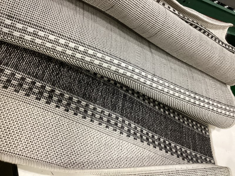 Condition photo showing As Is for washable rug outdoor courtyard collection - 8' x 10', black & grey, non-shedding & easy cleaning, ideal for patio, backyard, mudroom