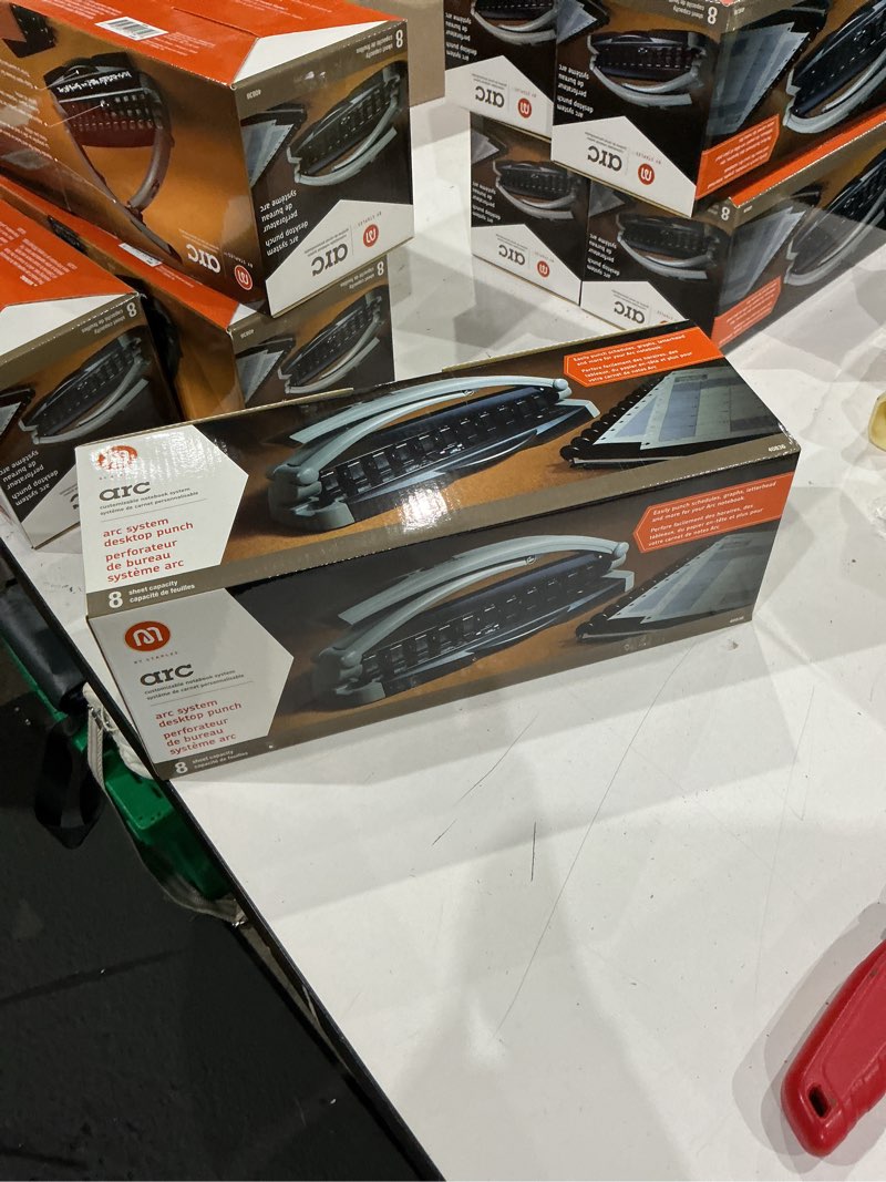 Condition photo showing New/Like New for staples arc desktop paper punch, 8-sheet capacity, black & gray