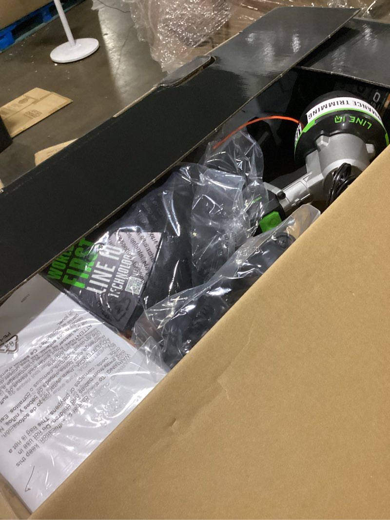 Condition photo showing As Is for ego power+ line iq with powerload st1623t 16 in. 56 v battery string trimmer kit (battery & charger) w/ telescopic shaft & 4.0 ah battery