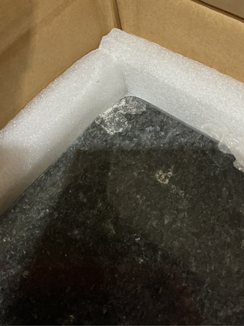 Condition photo showing As Is for CHIP IN CORNER Granite cutting board