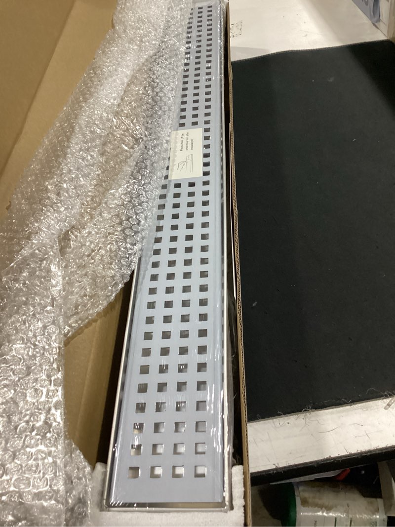 Condition photo showing Good Condition for sanitemodar 24 inch linear shower drain with removable square hole panel by using brushed 304 stainless steel process, linear drain equipped with adjustable feet and hair strainer stainless steel 24 inch