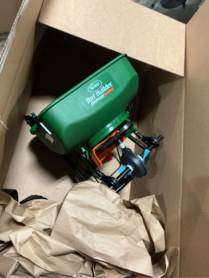 Condition photo showing As Is for scotts turf builder edgeguard mini broadcast spreader - spreads seed, fertilizer, ice melt