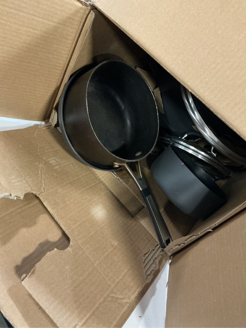 Condition photo showing As Is for calphalon 10-piece non-stick kitchen cookware set black pots & pans with stay-cool stainless steel handles hard-anodized aluminum for even heating 10-piece set