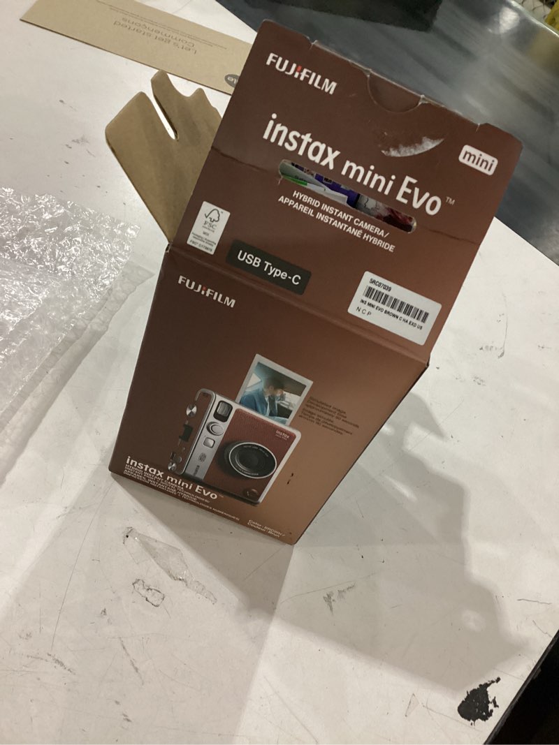 Condition photo showing As Is for fujifilm instax mini evo instant camera - brown *powers on but missing accessories *