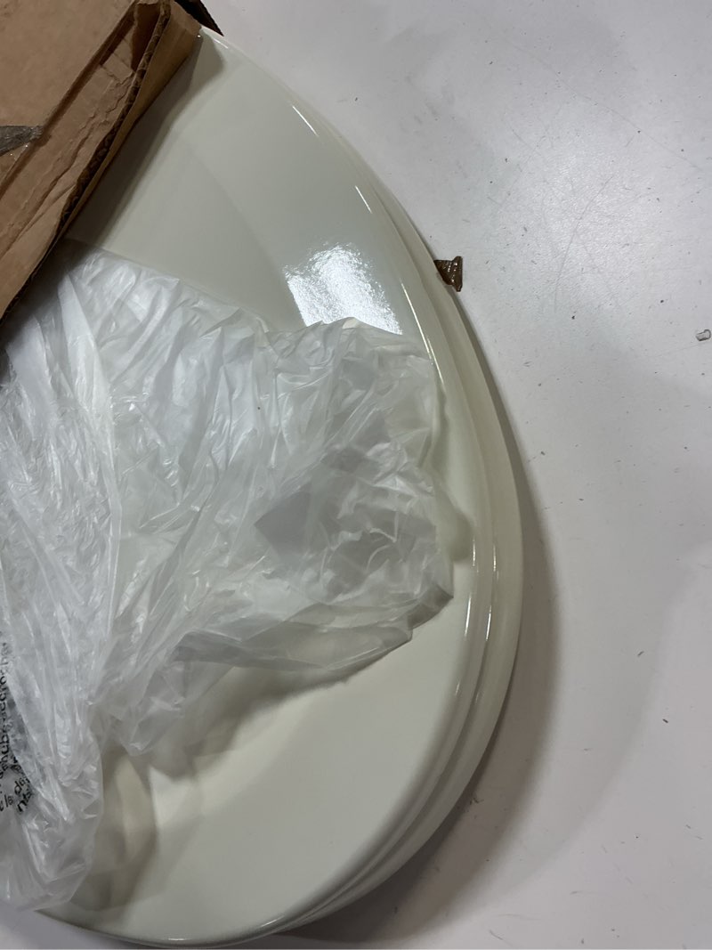 Condition photo showing As Is for Bemis Elongated Enameled Wood Toilet Seat in Biscuit with Easy•Clean? Hinge