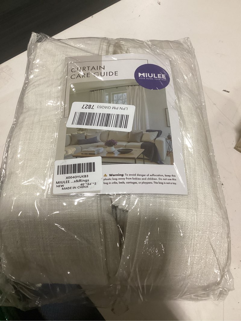 Condition photo showing New/Like New for miulee pinch pleated thick linen curtains 84 inches long 2 panels for living room bedroom, linen textured memory trained drapes pleat back tab light filtering natural window curtains with hooks&rings 40"w x 84"l (pack of 2) natural
