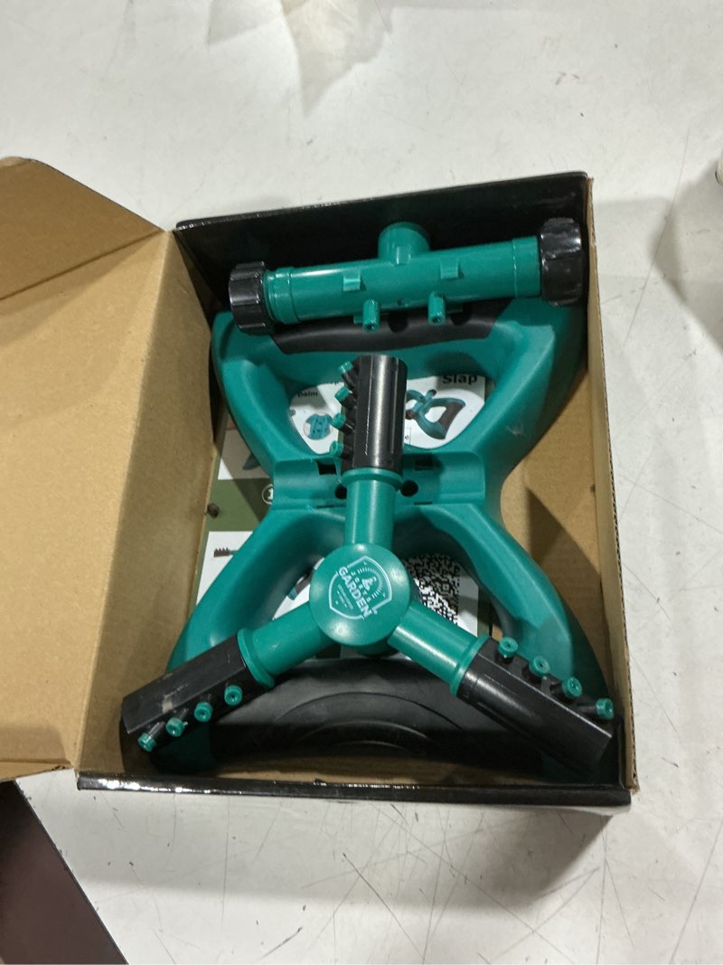 Condition photo showing As Is for joeys sprinkler for yard, rotating garden sprinkler with 3 adjustable arms, weighted base, expandable connection, lawn and yard sprinklers (green)