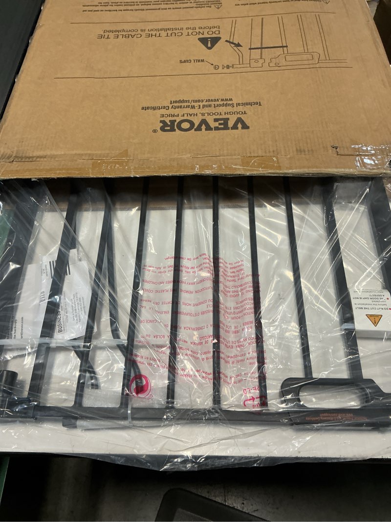 Condition photo showing New/Like New for vevor baby gate, 29.5-37 in adjustable width, 30in high dog gate, easy step walk thru, auto close, child pet security, with pressure mount kit and wall mount kit, for stairs doorways and house, black