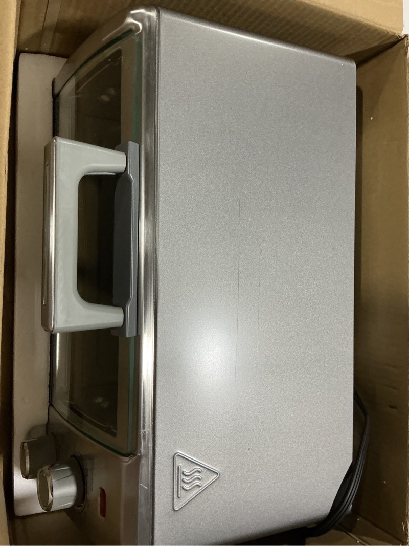 Condition photo showing As Is for BLACK+DECKER Crisp 'N Bake Air Fry Countertop Convection Toaster Oven, Medium Capacity, 4-Slice, 5-in-1, Fits 9” Pizza, 30-Min Timer, Bake, Broil, Air Fry, Toast, Keep Warm, Stainless Steel