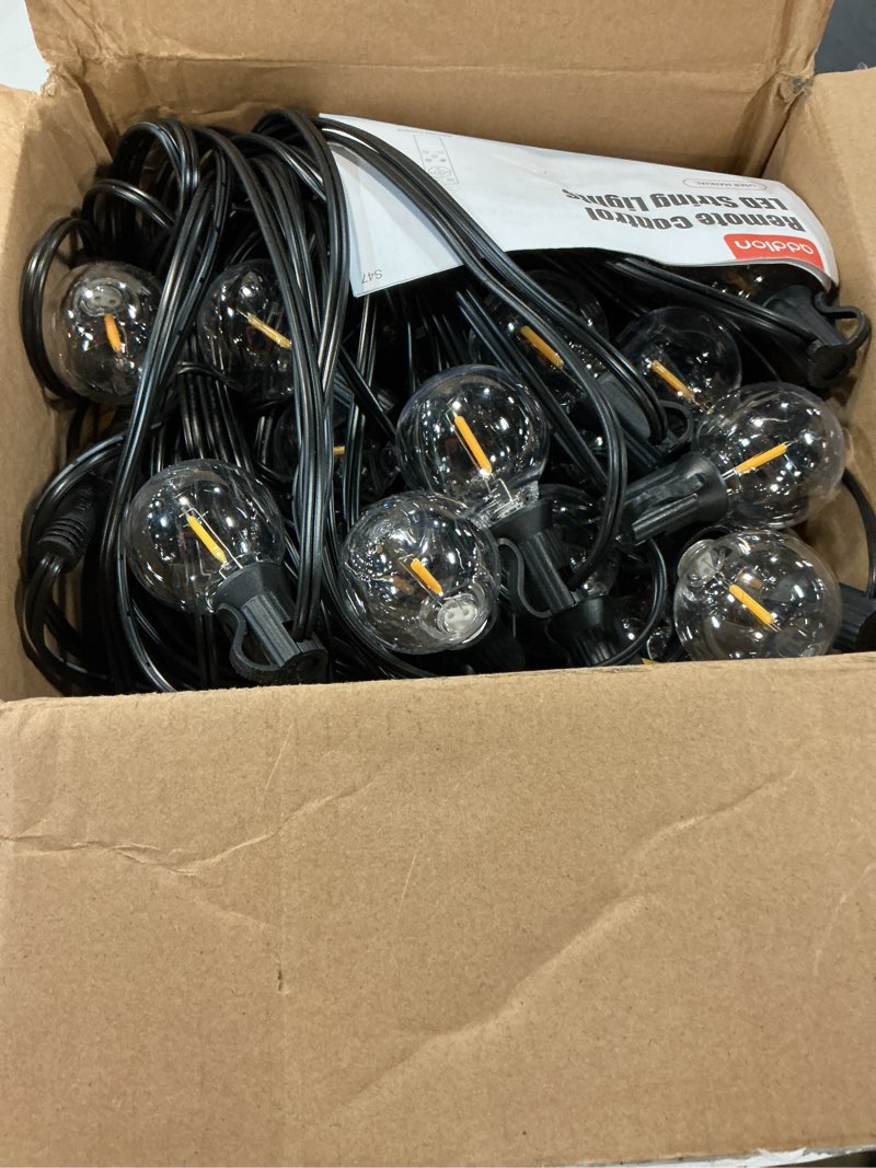 Condition photo showing Good Condition for addlon 100ft outdoor string lights g40 with remote, 54 led shatterproof bulbs, dimmable patio globe lights waterproof, hanging outside lighting for backyard, garden, deck, balcony, porch, café, decor 100ft(50 sockets)