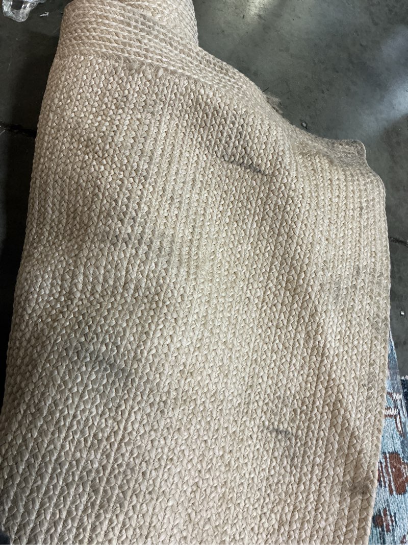 Condition photo showing As Is for 7'x10' natural woven rectangular braided outdoor area rug heathered cream - threshold ?
