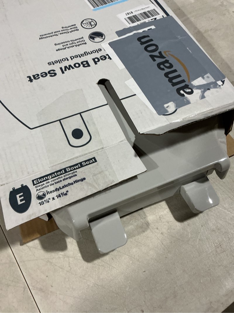 Condition photo showing As Is for "KOHLER 4636-RL-95 Cachet ReadyLatch Elongated Toilet Seat Slow Close, Soft Close Toilet Seat Quiet Lid, Contoured Grip-Tight Bumpers Installation Hardware, Apartment Essentials, Ice Grey " Ice Gray Elongated Ready Latch